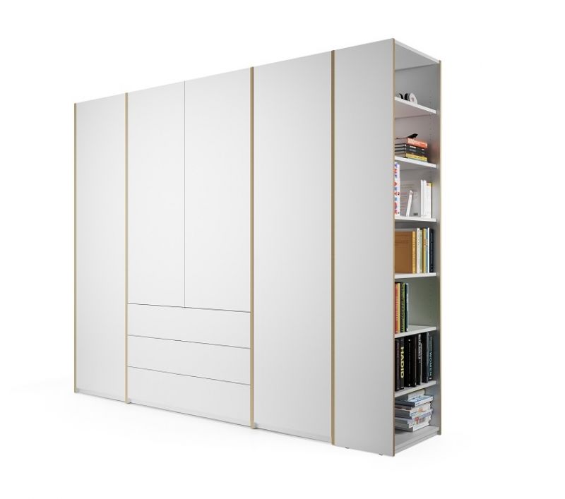 Weißer MODULAR PLUS Schrank von Müller Möbelwerkstätten mit Anbauregal rechts, gefüllt mit Büchern.